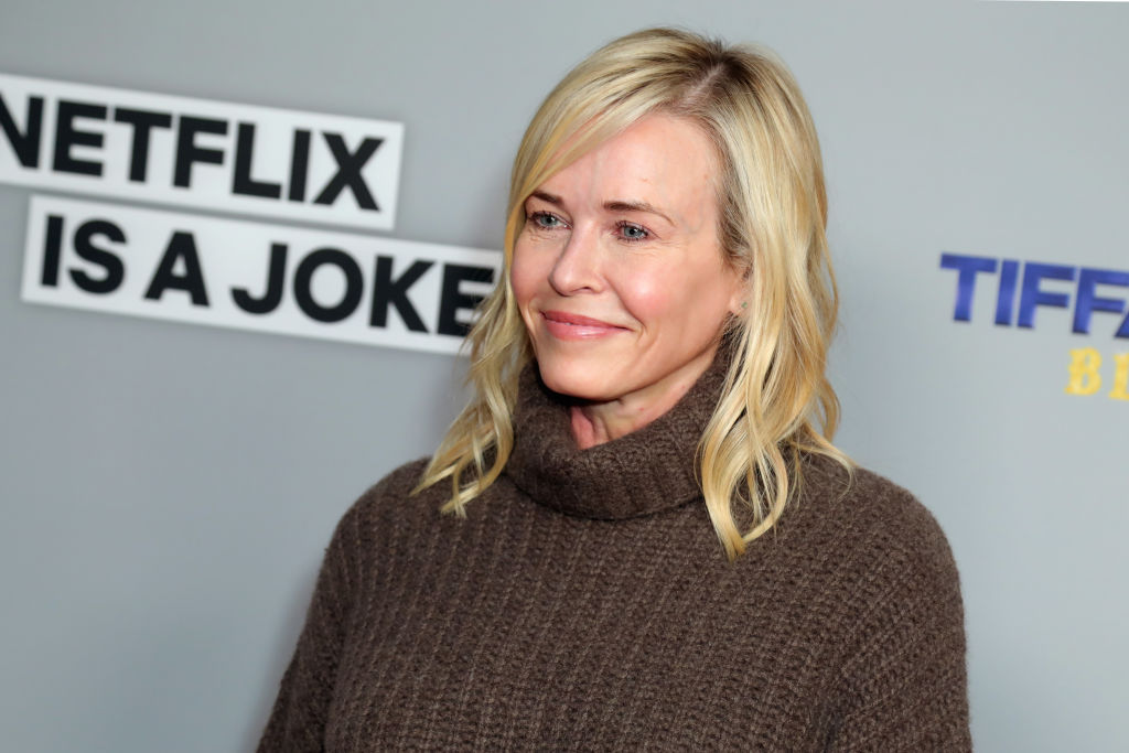 Chelsea Handler in a turtleneck sweater, smiling off camera