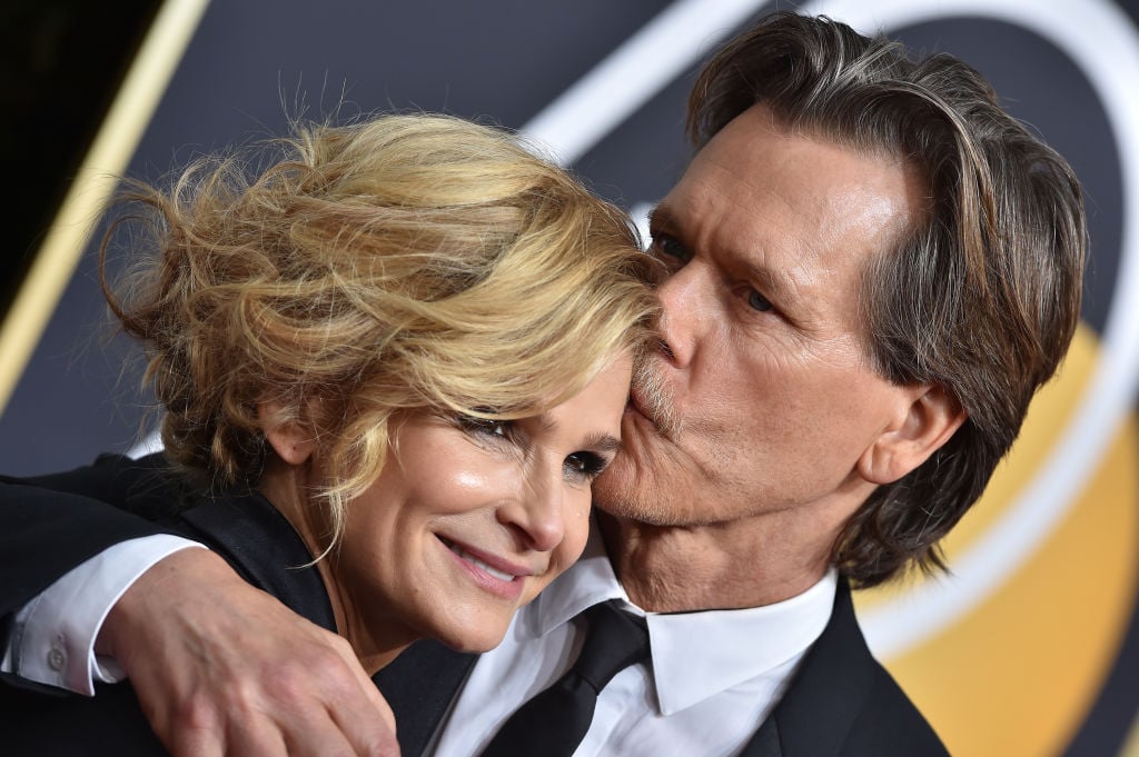 Kevin Bacon kisses Kyra Sedgwick on the cheek on the red carpet