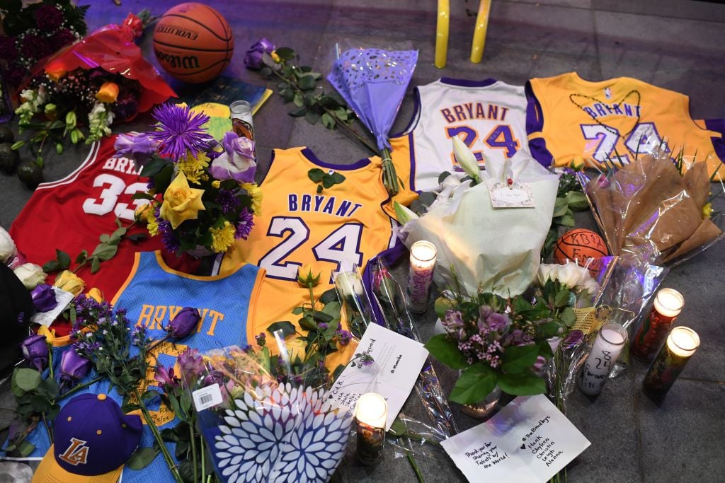Jerseys, flowers and candles are placed at a makeshift memorial as fans mourn the death of NBA legend Kobe Bryant,