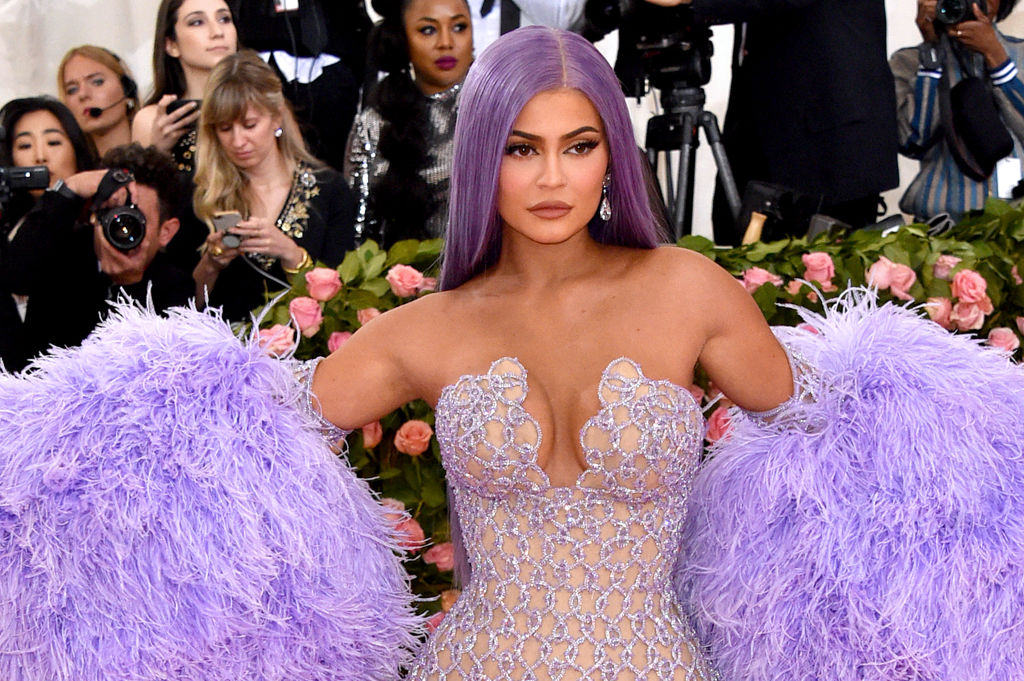 Kylie Jenner in a lavender dress with lavender fluffy sleeves