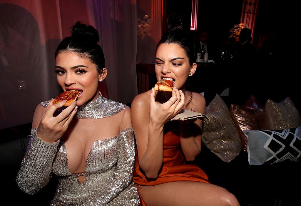 Kylie and Kendall Jenner eating pizza in formal dresses