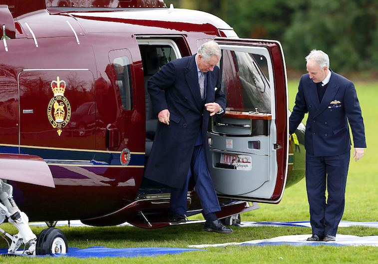 Prince Charles exits a helicopter
