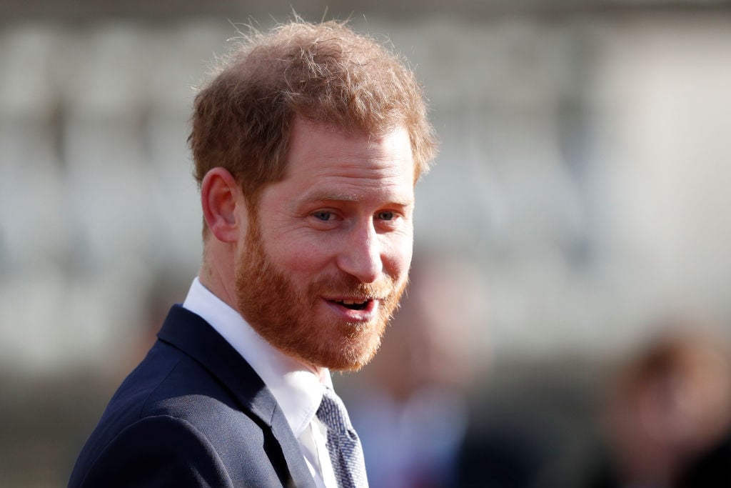 Prince Harry smiling, looking slightly off camera