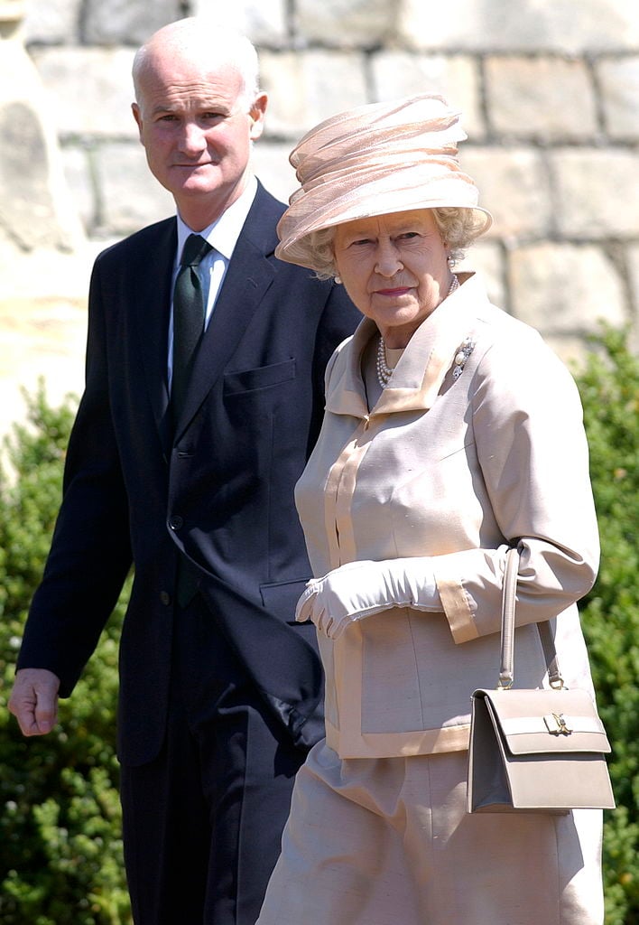 Queen Elizabeth II with former Keeper of the Privy Purse, Sir Michael Peat, in 2002