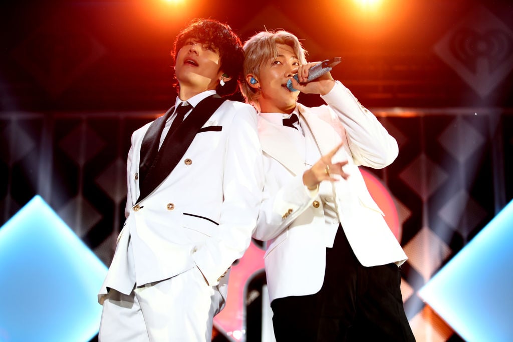 V and RM of BTS perform onstage during 102.7 KIIS FM's Jingle Ball 2019