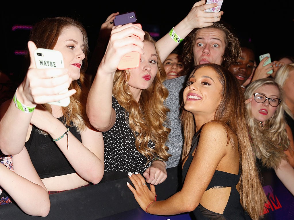 Ariana Grande poses for a selfie with fans as she attends the MTV EMA's 2014 in Glasgow, Scotland.