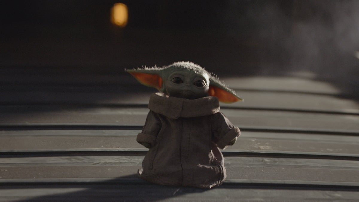 The Child (aka Baby Yoda) stands on a ship in the Disney+ series 'The Mandalorian.'