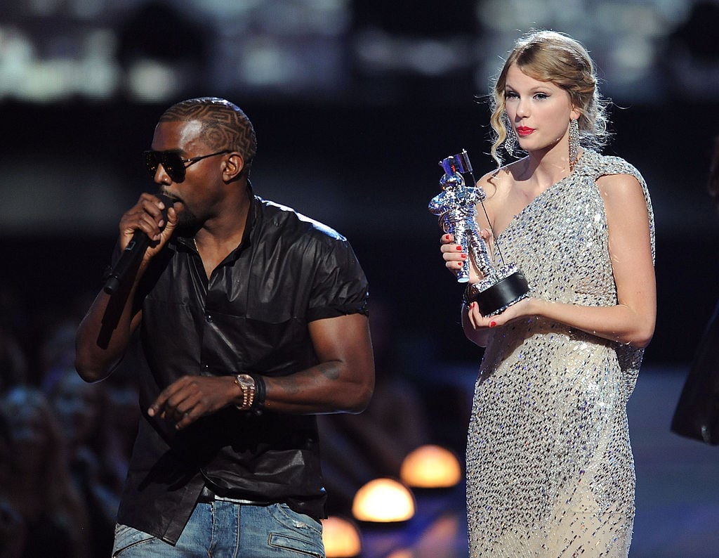 Kanye West takes the microphone from Taylor Swift and speaks onstage during the 2009 MTV Video Music Awards