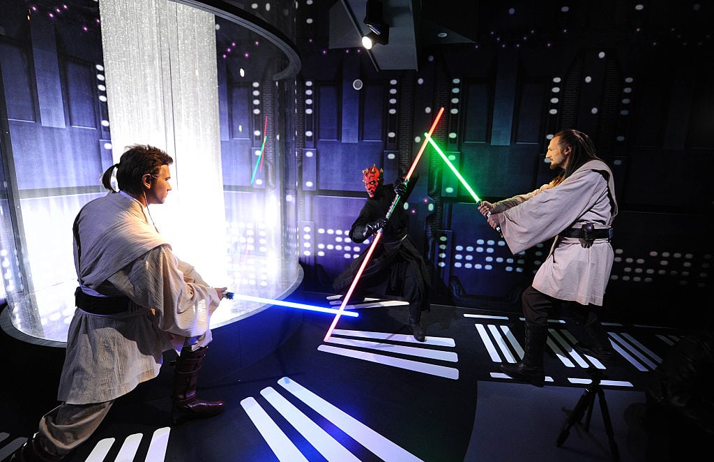 Wax figures of 'Star Wars characters' Obi-Wan Kenobi, Darth Maul, and Qui-Gon Jinn on display at 'Star Wars At Madame Tussauds' in London, England.