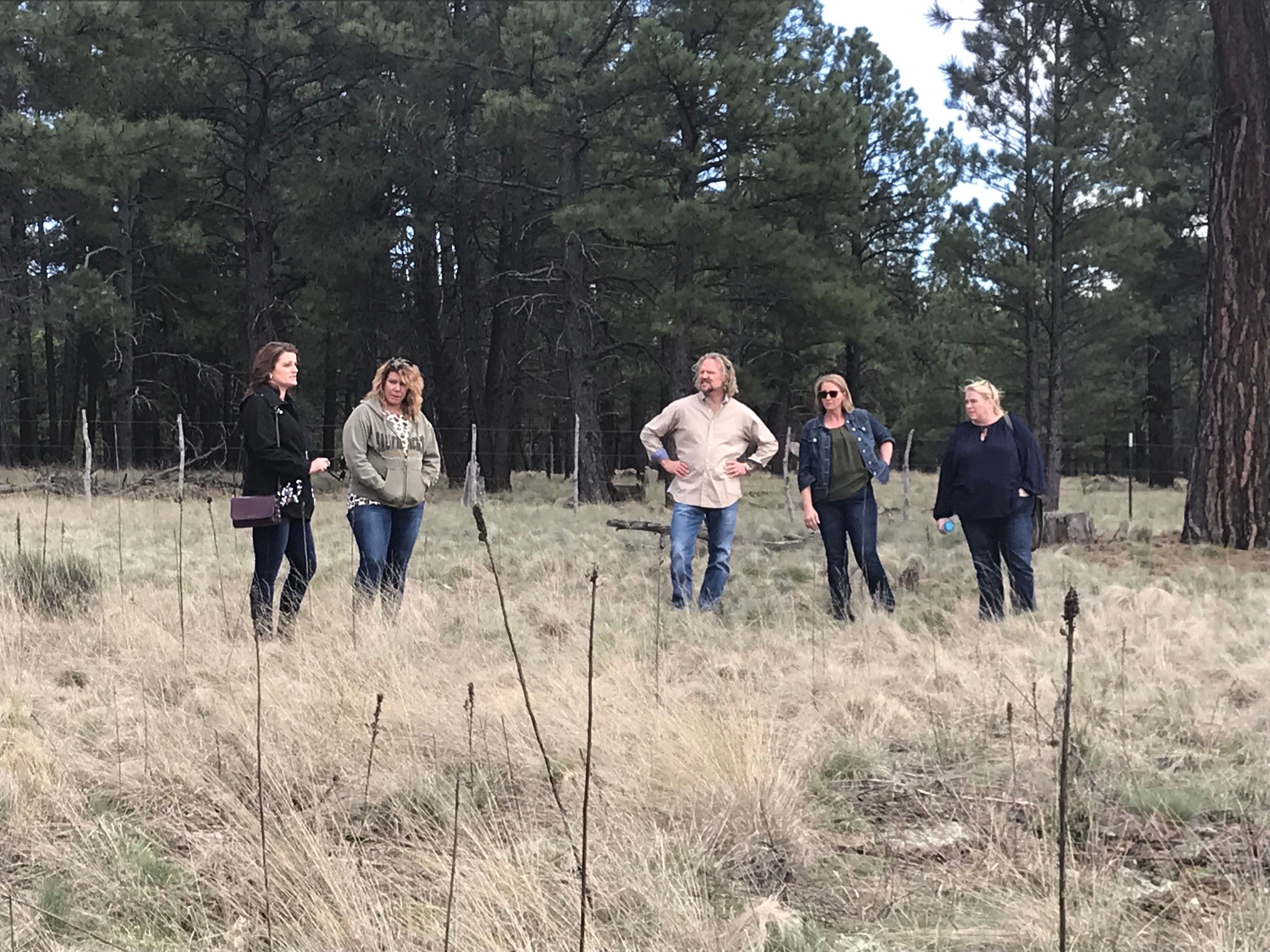 The Brown family standing in a field