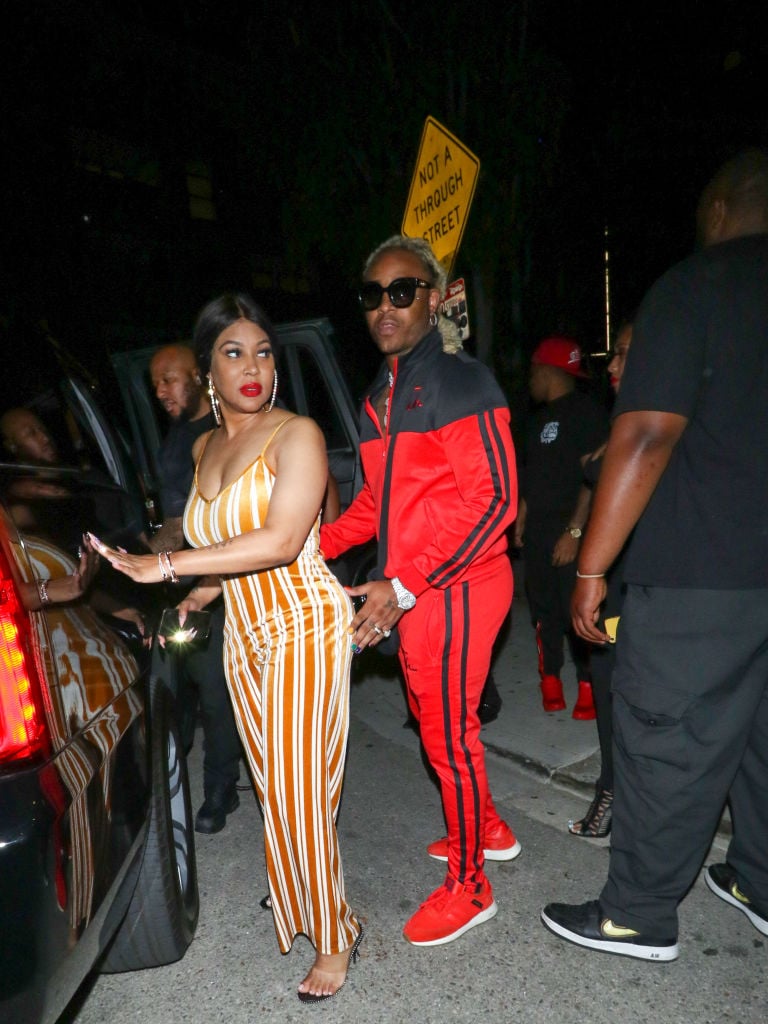 Lyrica Anderson and A1 Bentley outside a car