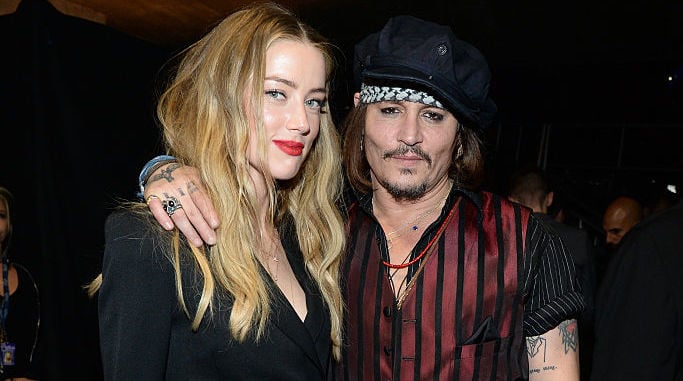 Amber Heard and Johnny Depp at an award show in 2016