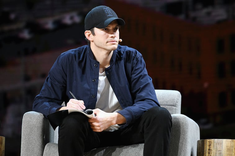 Ashton Kutcher speaks onstage