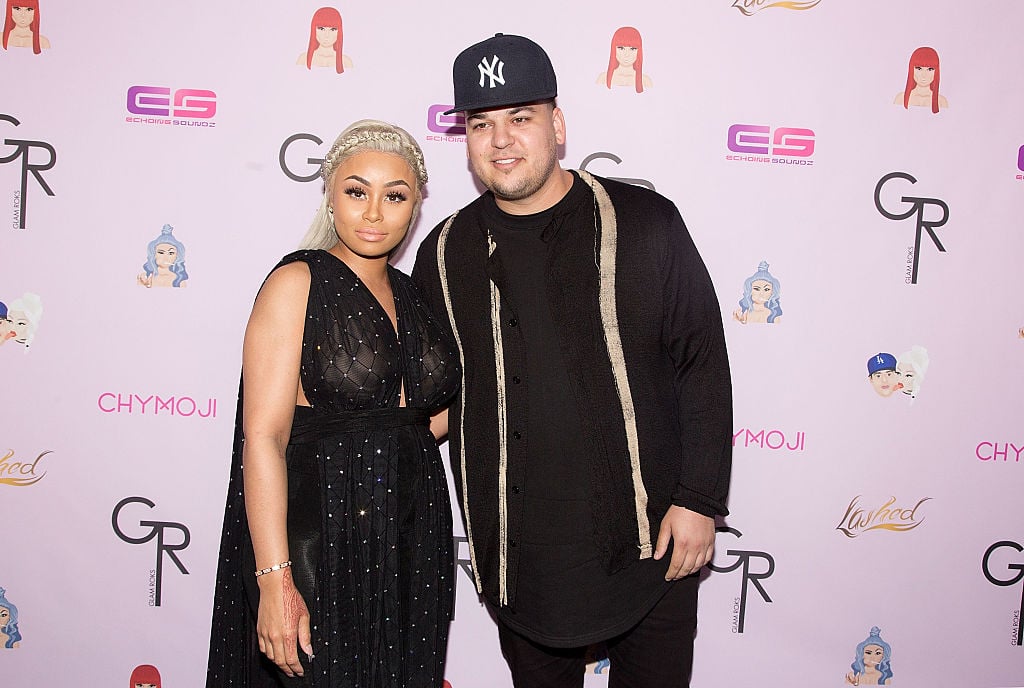 Blac Chyna and Rob Kardashian in front of a repeating background