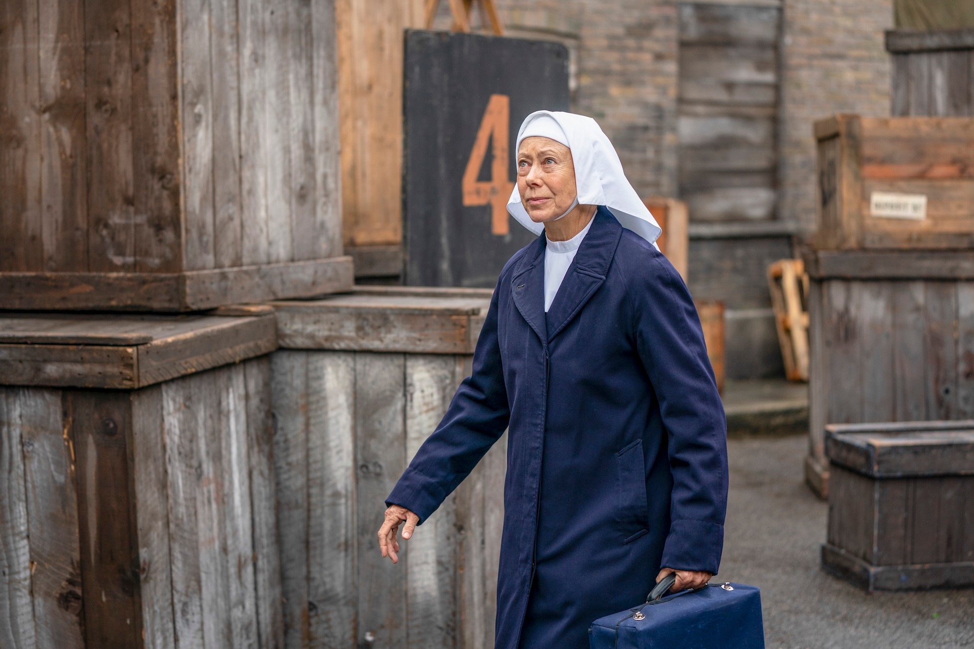 nun carrying medical bag