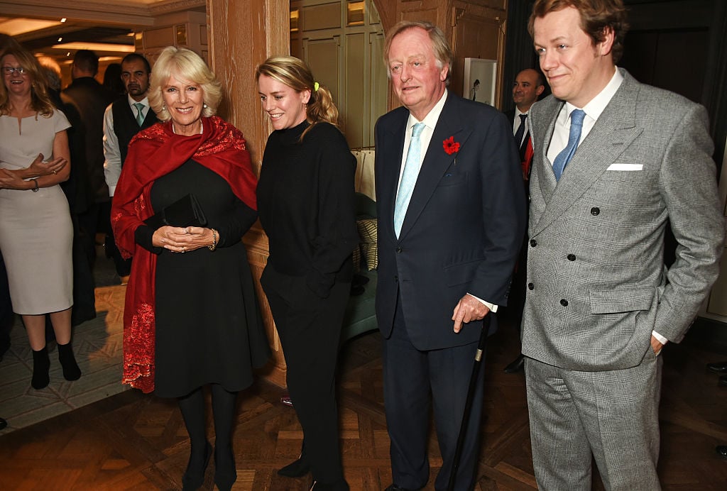 Camilla Parker Bowles, Laura Lopes, and Andrew Parker Bowles pose with Tom Parker Bowles at the launch of his book, 'Fortnum and Mason: The Cook Book' on Oct. 18, 2016