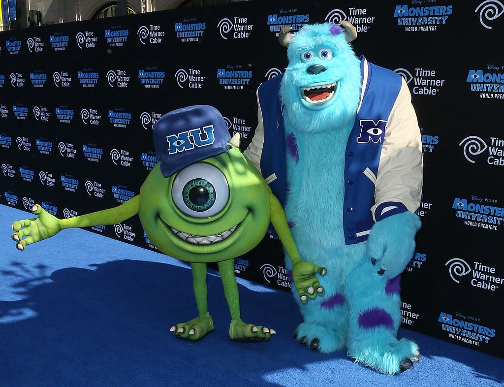 Actors portraying "Mike" and "Sulley" attend the premiere of Disney Pixar's "Monsters University"