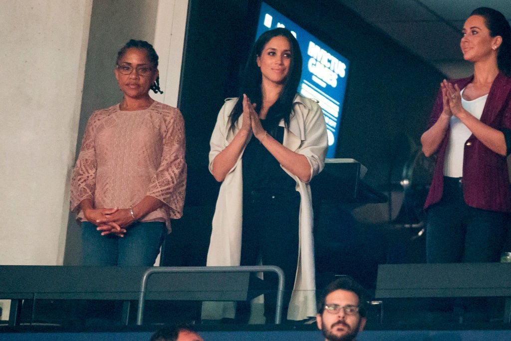 Doria Ragland, Meghan Markle, and Jessica Mulroney watch the closing ceremonies of the Invictus Games in 2017