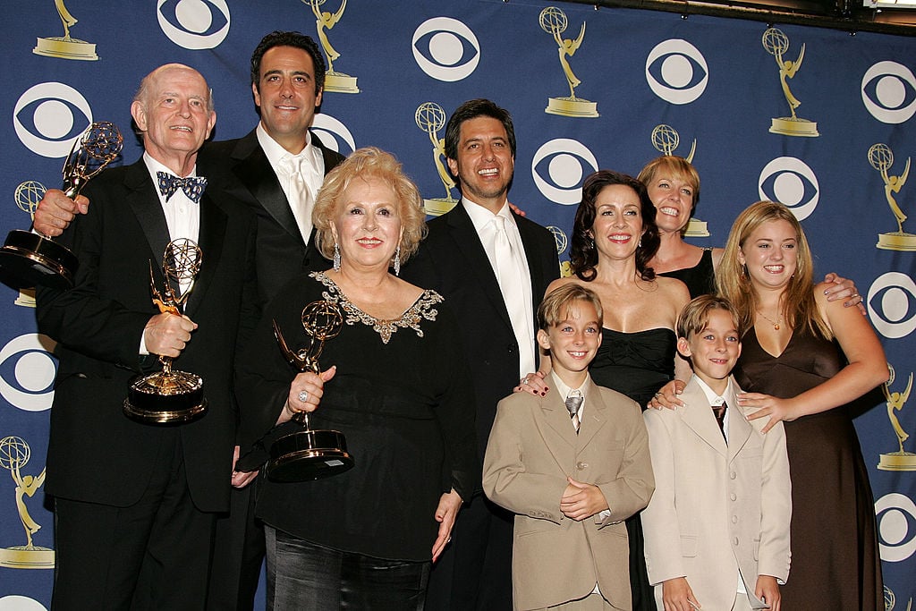 The cast of 'Everybody Loves Raymond', (L-R) Peter Boyle, Brad Garrett, Doris Roberts, Ray Romano, Patricia Heaton, Monica Horan, Sawyer Sweeten, Sullivan Sweeten and Madylin Sweeten pose with the Emmy for Outstanding Comedy Series in the press room at the 57th Annual Emmy Awards