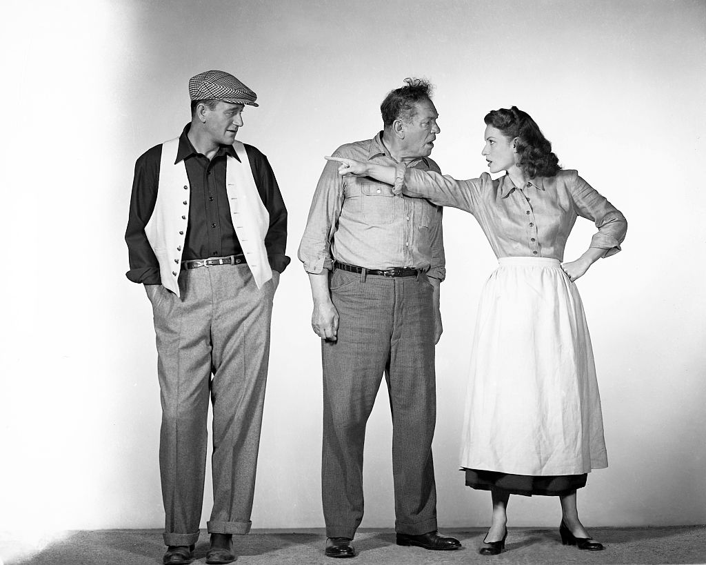 From left to right, actors John Wayne (1907 - 1979) as Sean Thornton, Victor McLaglen (1886 - 1959) as Squire 'Red' Will Danaher and Maureen O'Hara (1920 - 2015) as Mary Kate Danaher in a publicity still for the film 'The Quiet Man', 1952