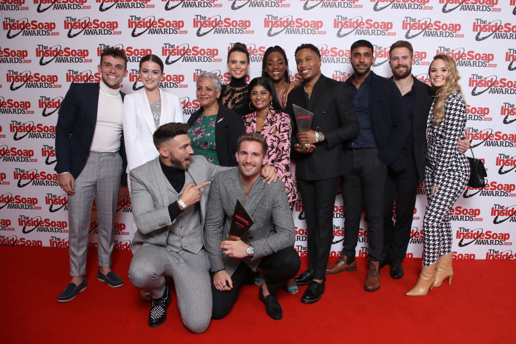 Hollyoaks cast in front of a repeating background