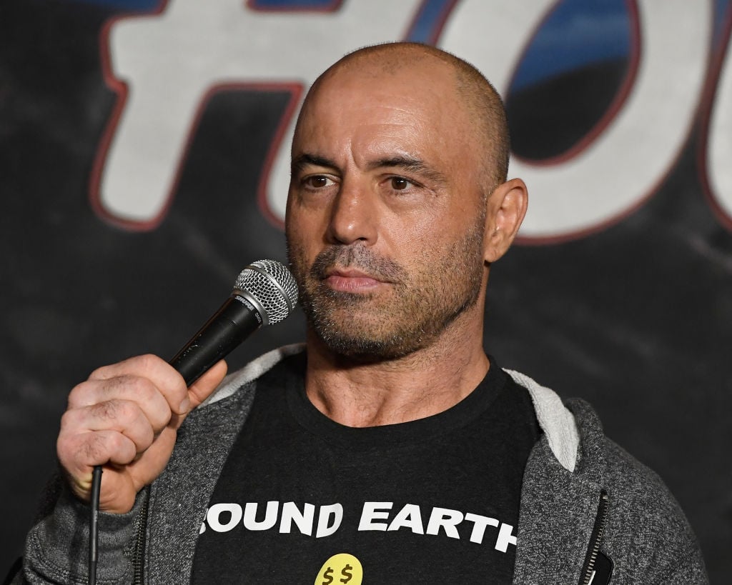 Joe Rogan holding a microphone