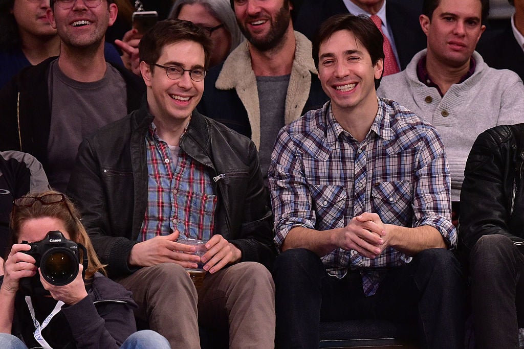 Christian and Justin Long in plaid, laughing