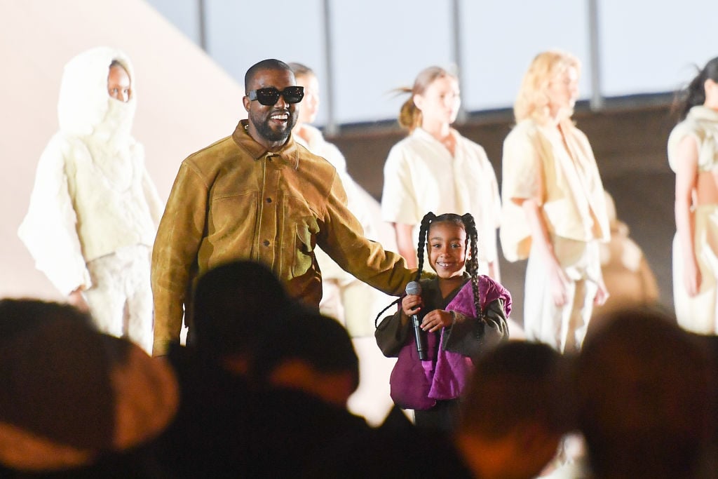 Kanye West and North West at a fashion show in March 2020