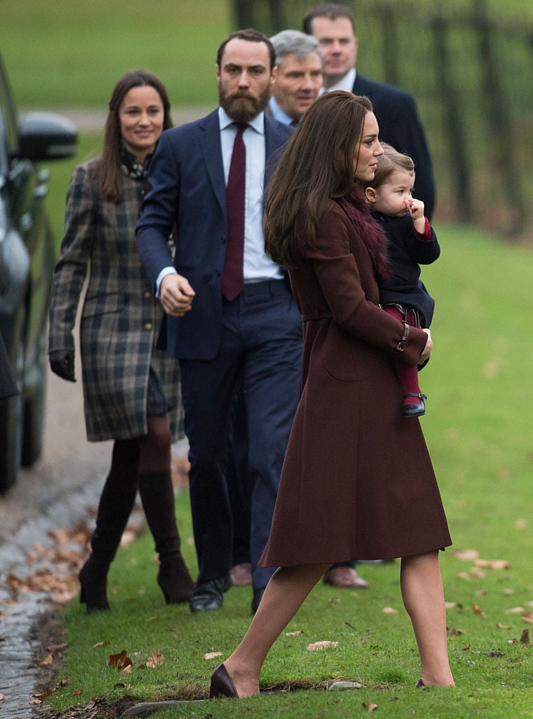 Kate Middleton carries Princess Charlotte, with brother James Middleton, sister Pippa Middleton, and father Michael Middleton, on Dec. 25, 2016