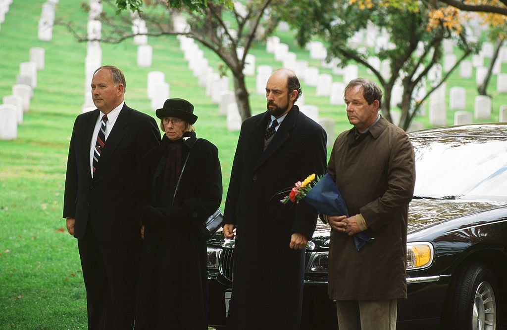 Kathryn Joosten as Dolores Landingham, Richard Schiff as Toby Ziegler, and Paul Austin as George Huffnagle in 'The West Wing' Season 1 Episode 10: "In Excelsis Deo." 