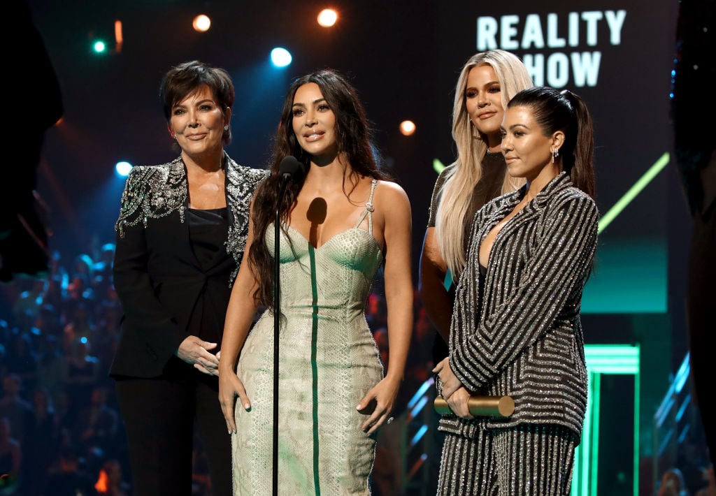 Kris Jenner, Kim Kardashian, Khloé Kardashian, and Kourtney Kardashian accept The Reality Show of 2019 for 'Keeping Up with the Kardashians' on stage during the 2019 E! People's Choice Awards
