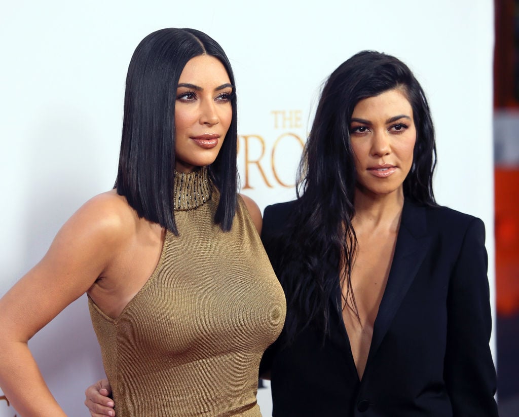 Kim Kardashian West and Kourtney Kardashian attend Open Road Films' "The Promise" at TCL Chinese Theatre