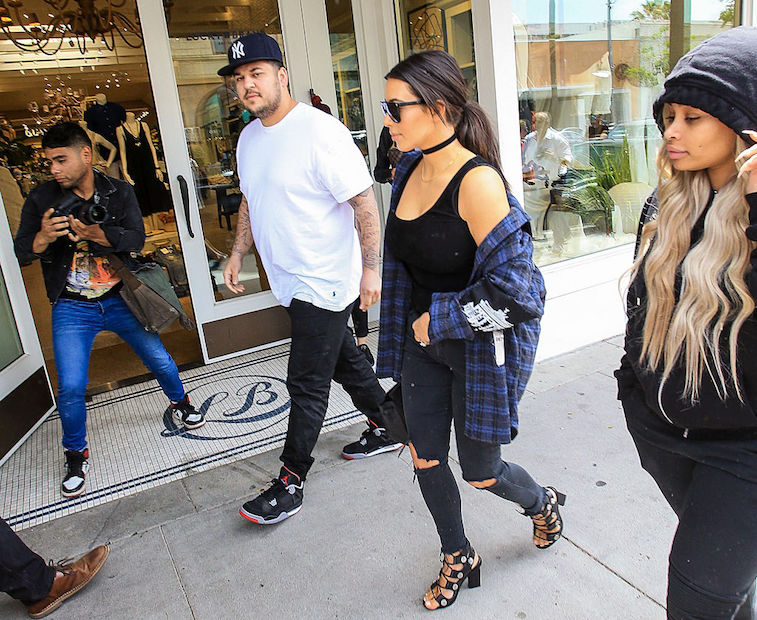 Kim Kardashian walks with Rob Kardashian and Blac Chyna in 2016