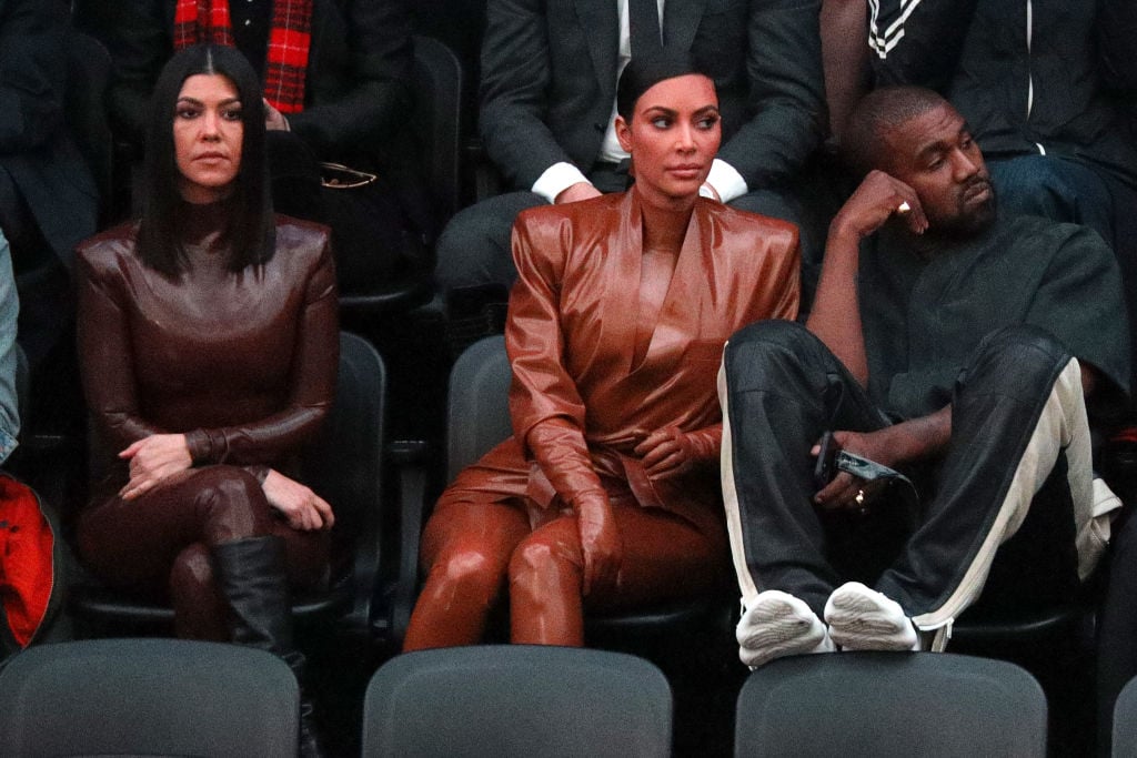 Kourtney Kardashian, Kim Kardashian West, and Kanye West attend the Balenciaga show as part of the Paris Fashion Week