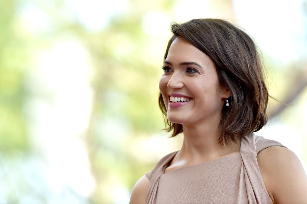 Mandy Moore smiling, turned slightly off camera