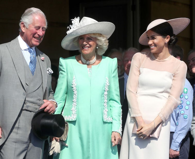 Prince Charles, Camilla Parker Bowles, and Meghan Markle share a laugh
