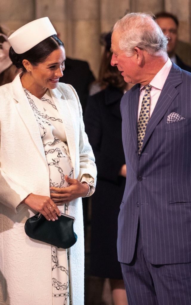 Meghan Markle and Prince Charles talk while attending the Commonwealth Day service at Westminster Abbey on March 11, 2019