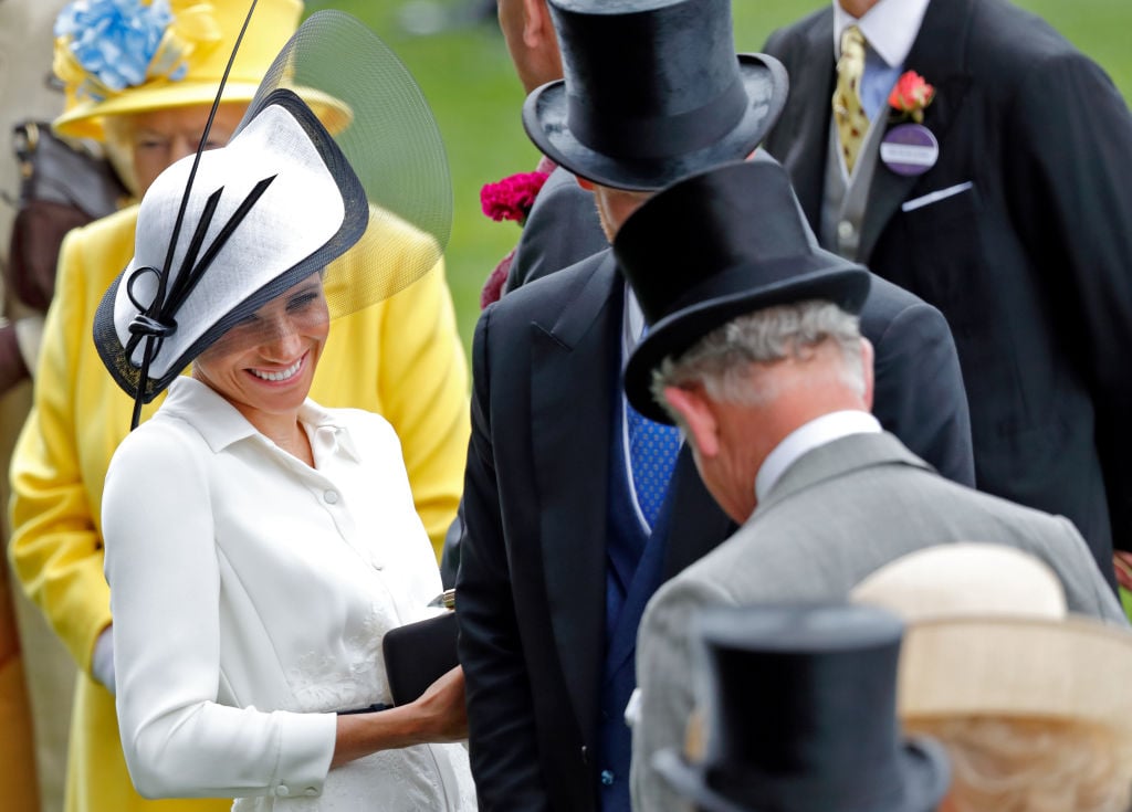 Meghan Markle stands with Prince Harry and Prince Charles at Day 1 of the Royal Ascot on June 19, 2018