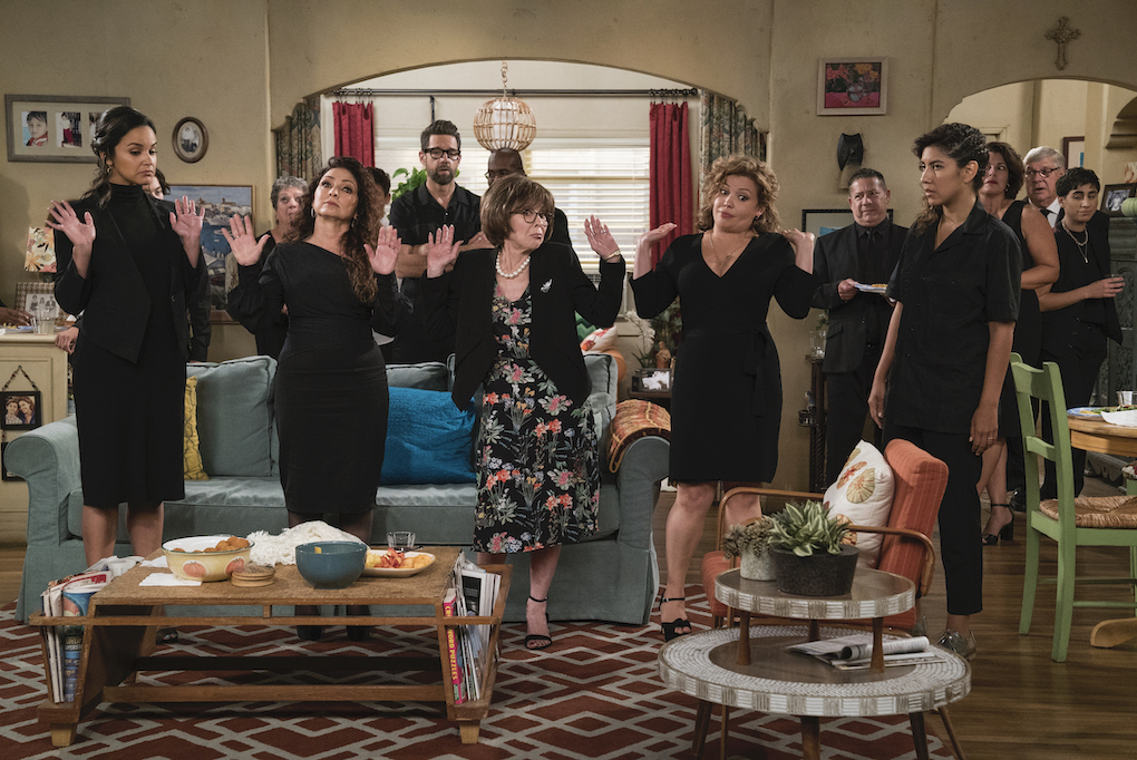 Penelope (Justina Machado), Lydia (Rita Moreno), and others at a funeral in Episode 7, Season 3, 'One Day at a Time.'
