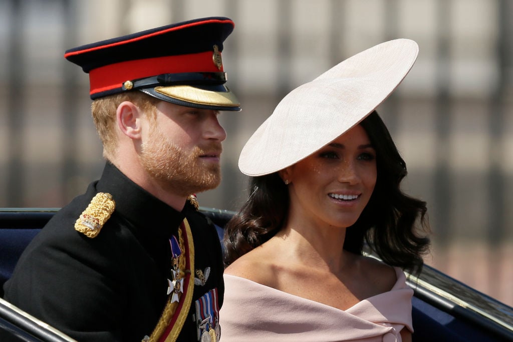 Prince Harry and Meghan Markle depart from Buckingham Palace during the Trooping the Colour ceremony