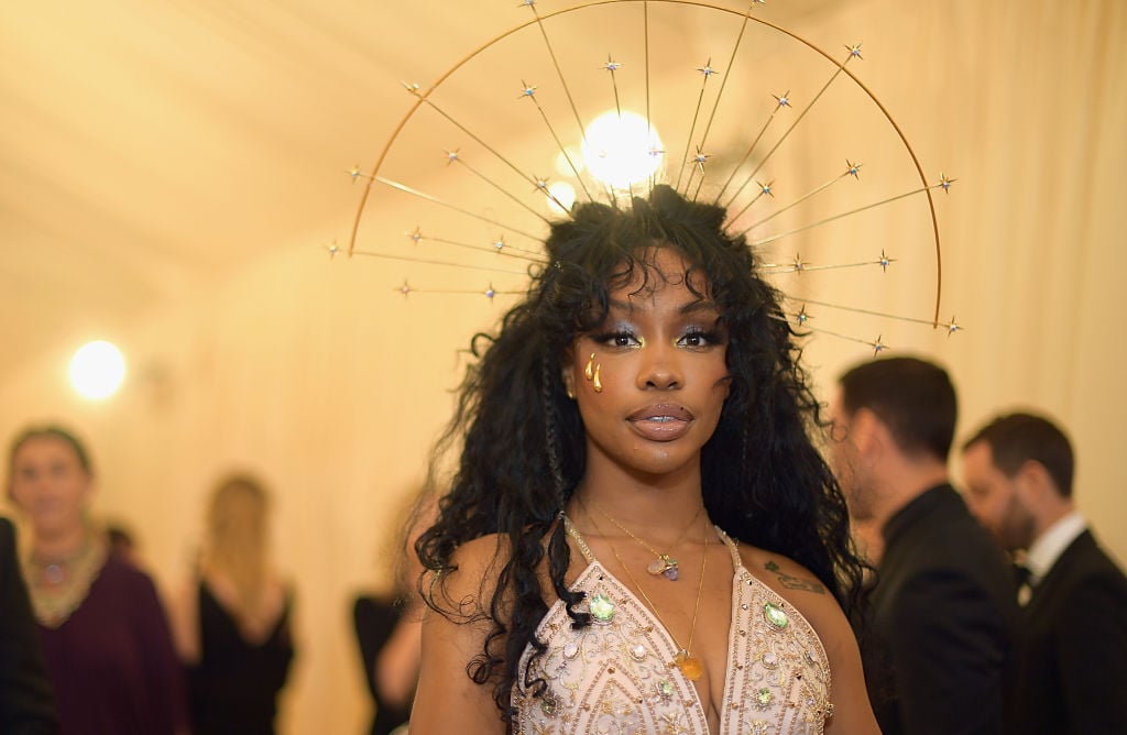 SZA in a crown and light pink beaded dress