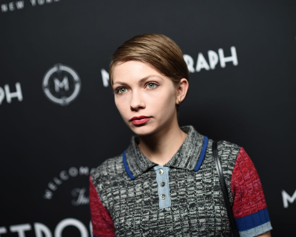 Tavi Gevinson in front of a repeating background