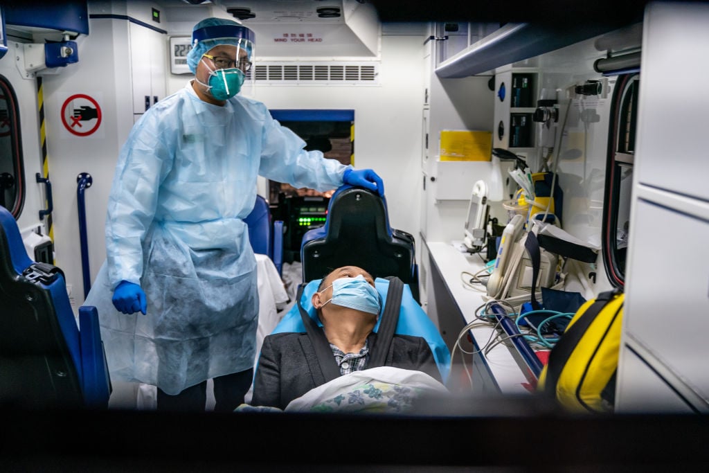 A Hong Kong coronavirus (COVID-19) patient is transferred by ambulance