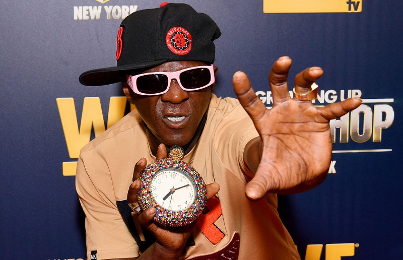 Flavor Flav reaching out with his hand