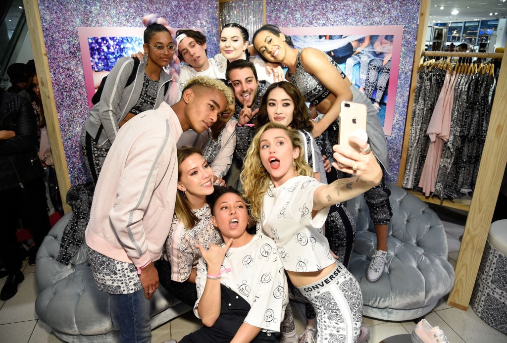 Miley Cyrus and fans post during Converse X Miley Cyrus Pop-Up Shop at The Grove on May 1, 2018 in Los Angeles, California.