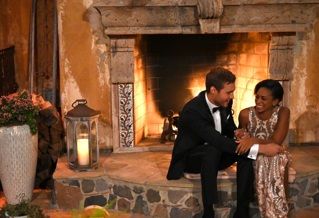 Shiann Lewis with Peter Weber on the first night of his 'The Bachelor' season in front of a fireplace.
