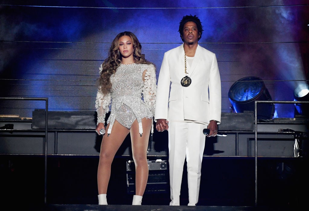 Beyoncé and Jay-Z holding hands on stage