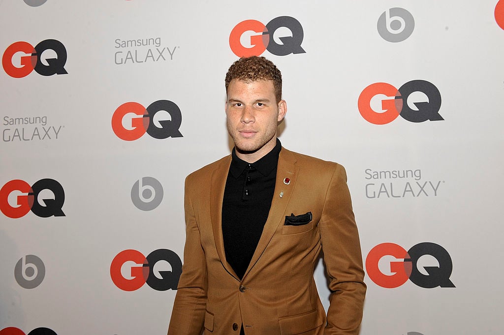 Blake Griffin smiling in front of a repeating background