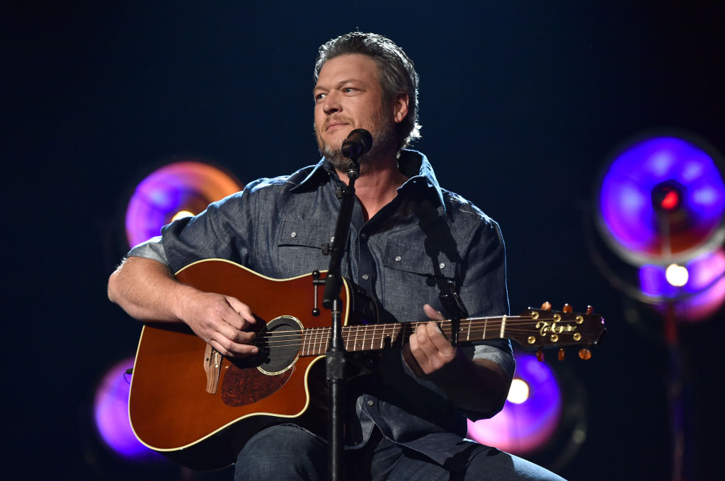 Blake Shelton on stage with a guitar