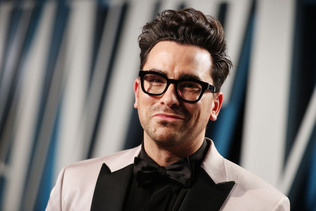 Dan Levy smiling at the camera